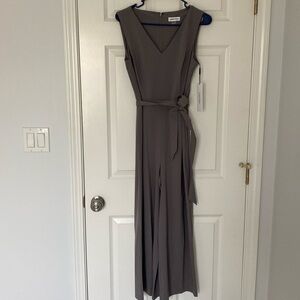 Brand new. Calvin Klein Commuter V-Neck Cropped Jumpsuit (Size 4)